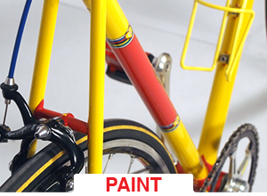yellow and red bicycle, close up of frame to show paint job